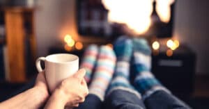 Energy efficient furnace - staying warm near the tv with candles and socks and tea