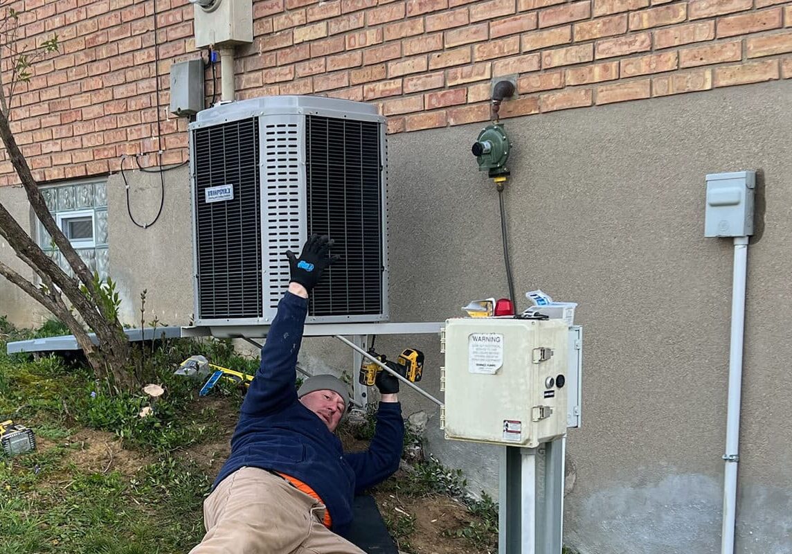 AC Installation, air conditioner installation, AC replacement, Air Conditioner replacement. Stacy Heating and Air installing a new air conditioner on a hill