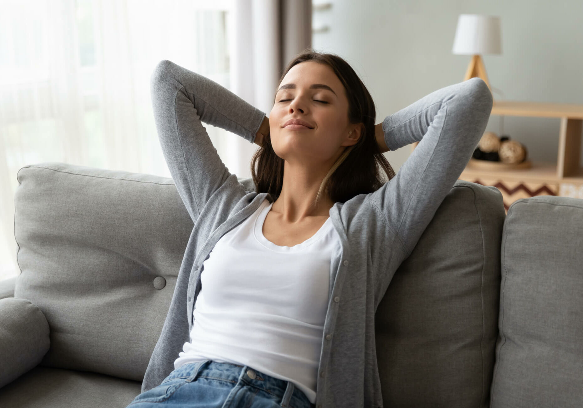 Harrison, Ohio Air Quality for your home - Woman relaxing on couch with arms behind her head